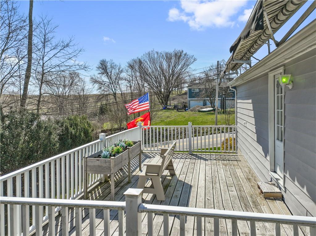 476 Cecil-Henderson Road Cecil, PA 15321 - Photo 24 of 37 a view of a balcony with wooden fence and floor