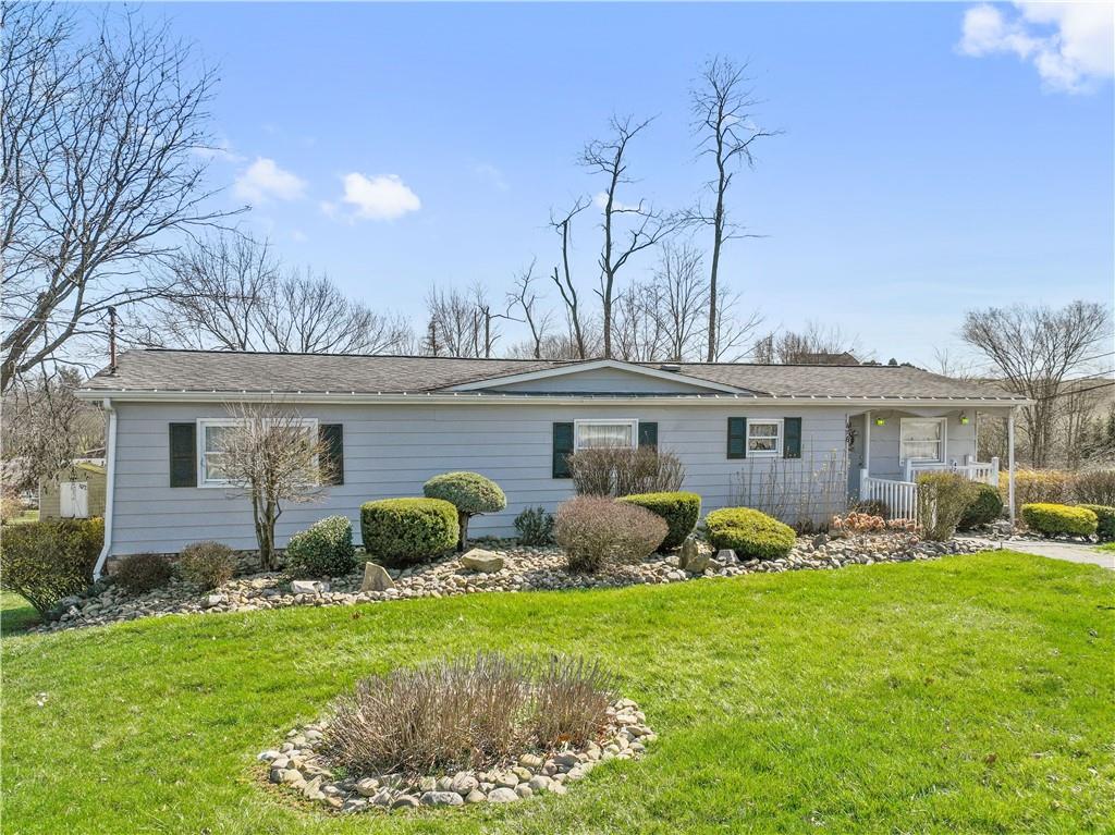476 Cecil-Henderson Road Cecil, PA 15321 - Photo 33 of 37 a front view of house with yard and outdoor seating