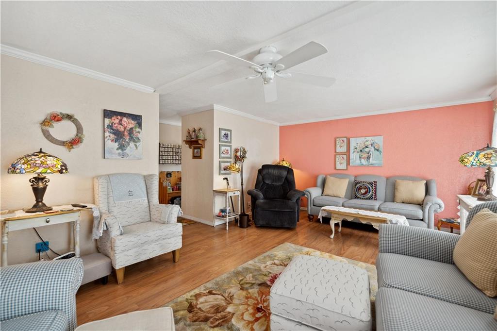 476 Cecil-Henderson Road Cecil, PA 15321 - Photo 5 of 37 a living room with furniture and a chandelier
