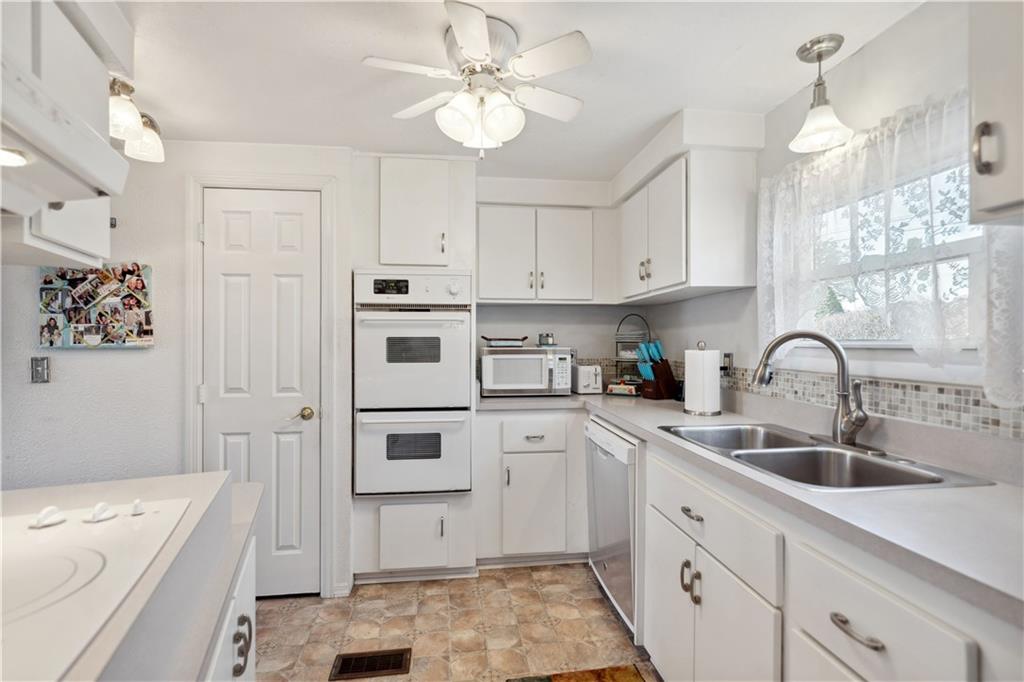476 Cecil-Henderson Road Cecil, PA 15321 - Photo 9 of 37 a kitchen with cabinets appliances and a sink
