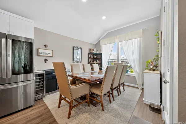 a view of a dining room with furniture and window