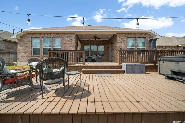 a view of a patio with table and chairs with wooden floor