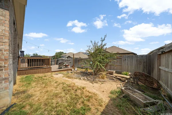 a view of a backyard of the house