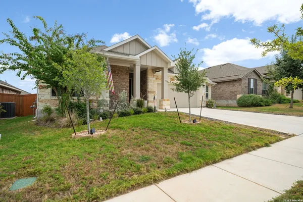 a view of a house with a backyard