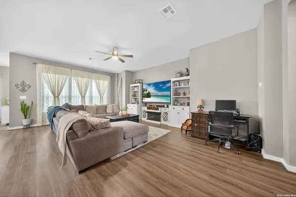 a living room with furniture and a large window
