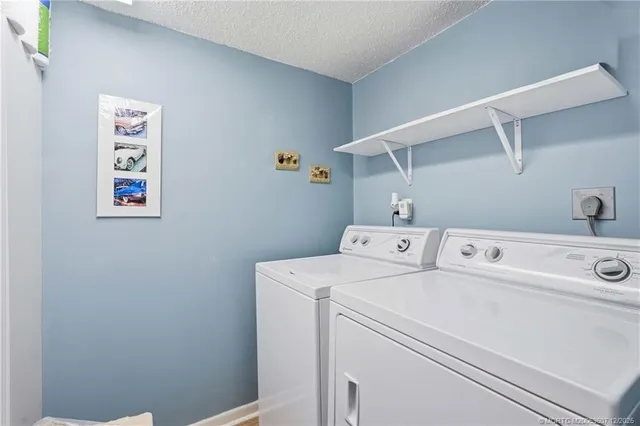 a view of a chairs and table in backyard
