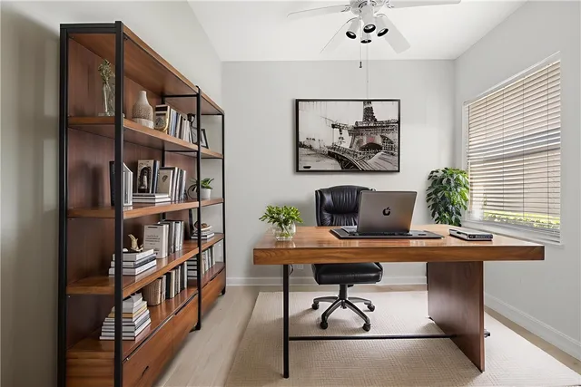 a bedroom with bed a flat tv screen and a couch