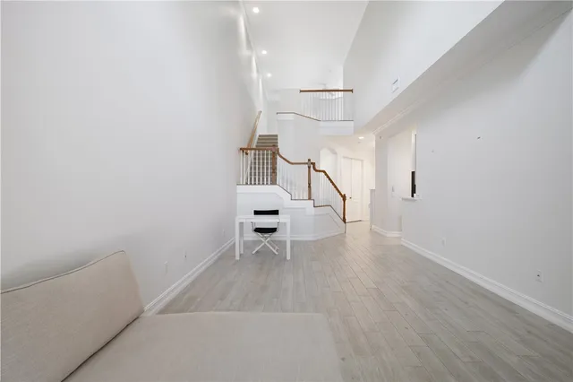 a view of an empty room with a ceiling fan