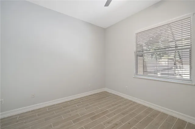 a bathroom with a sink a mirror and a window
