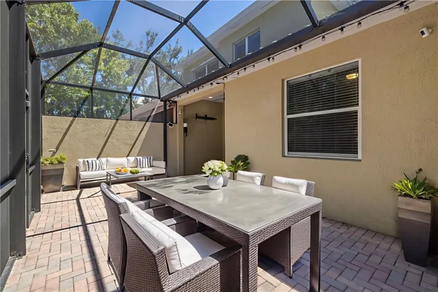 an aerial view of a residential houses with a yard and lake view