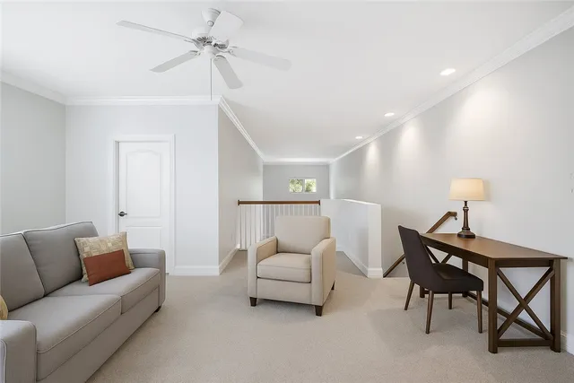 a workspace with furniture and a book shelf