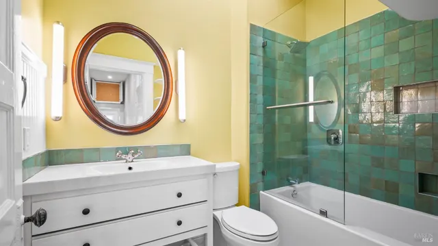 a view of dirt field with trees in the background