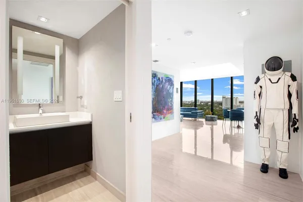a bathroom with a sink and mirror