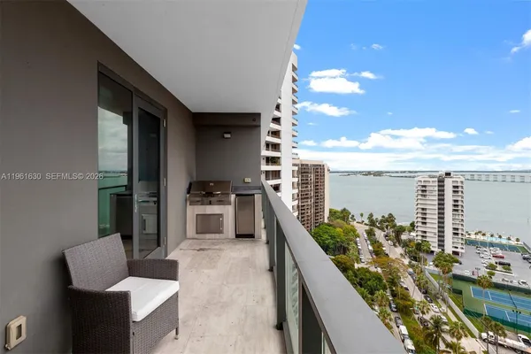a balcony with furniture and city view