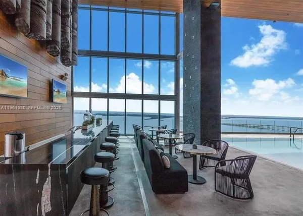 a view of balcony with chairs and outdoor seating
