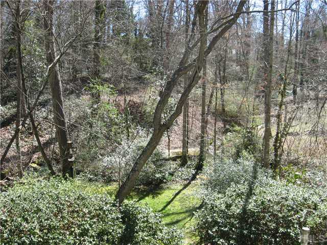 719 Runnymede Road Raleigh, NC 27607 - Photo 5 of 25 a backyard of a house with lots of green space