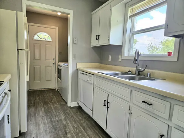 a kitchen with a sink and cabinets