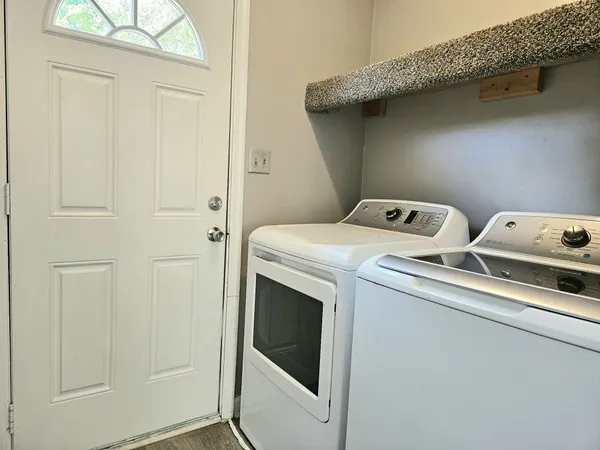 a utility room with dryer and washer