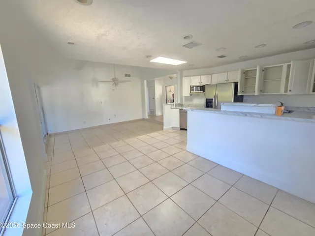 a view of kitchen and windows