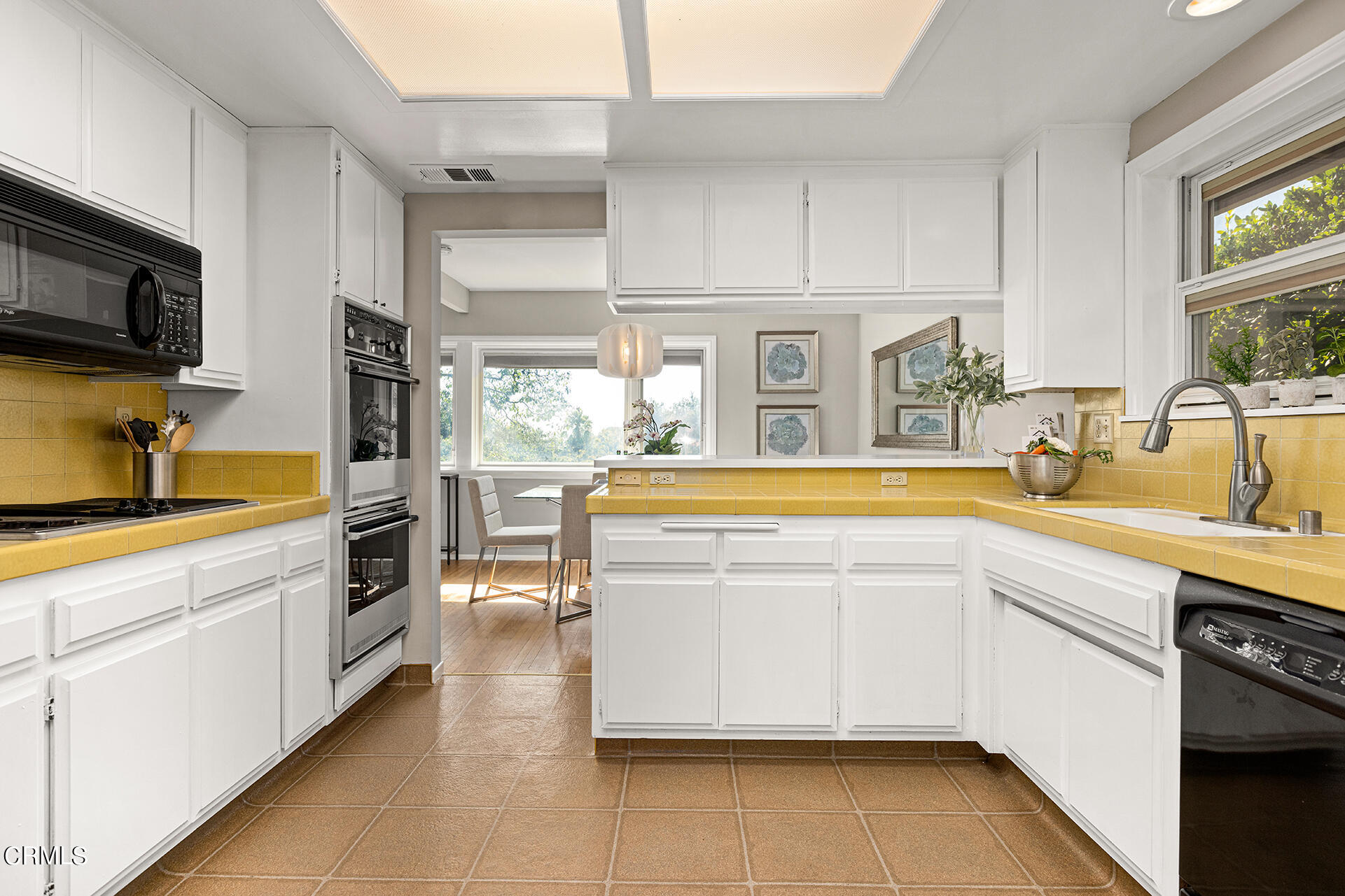 306 Cherry Drive Pasadena, CA 91105 - Photo 7 of 23 a kitchen with stainless steel appliances a sink stove and cabinets