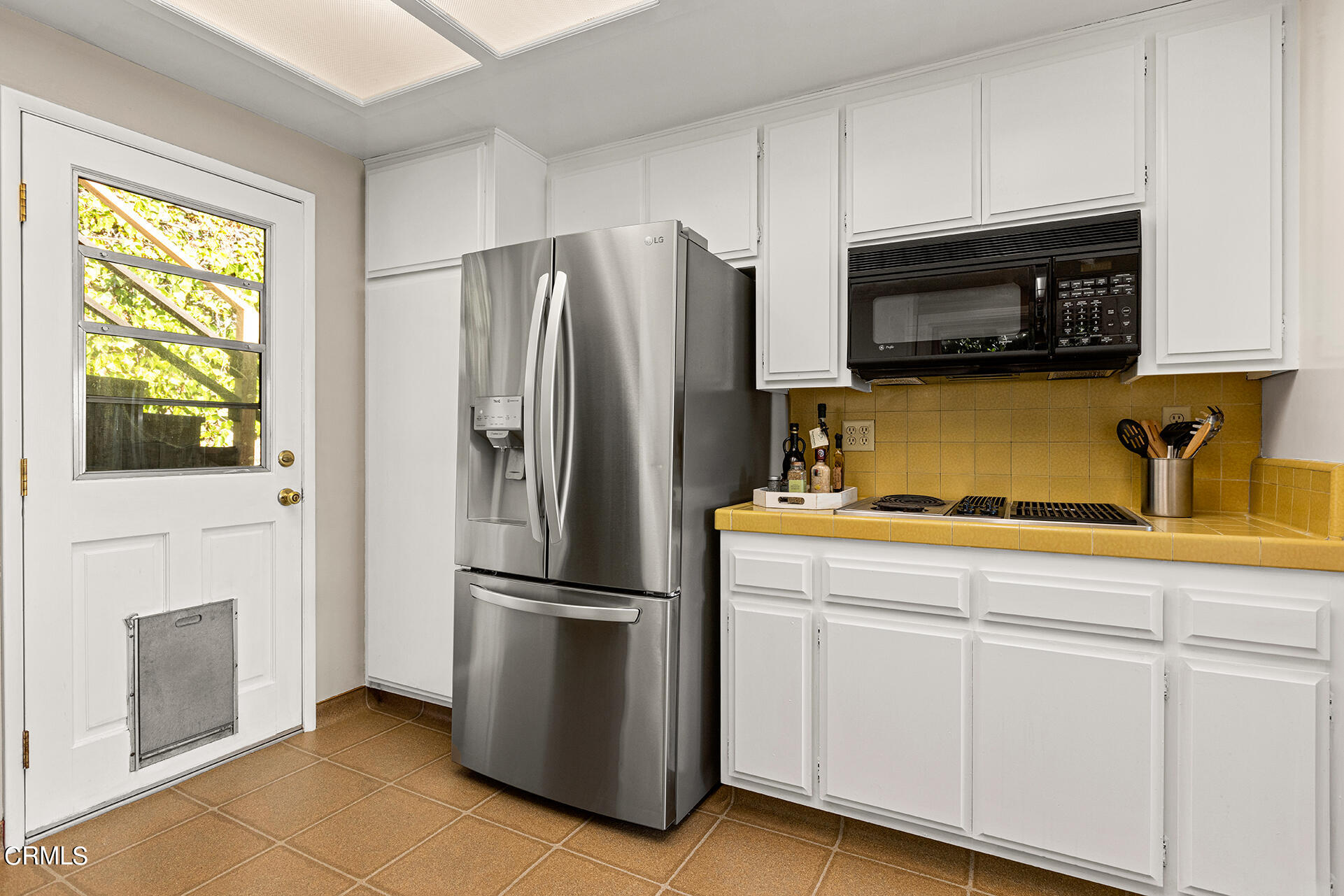 306 Cherry Drive Pasadena, CA 91105 - Photo 9 of 23 a kitchen with appliances a refrigerator and a sink