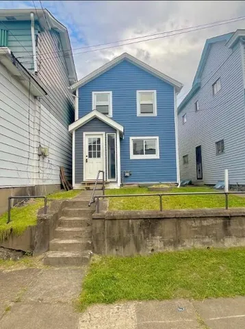 a view of a house with a swimming pool