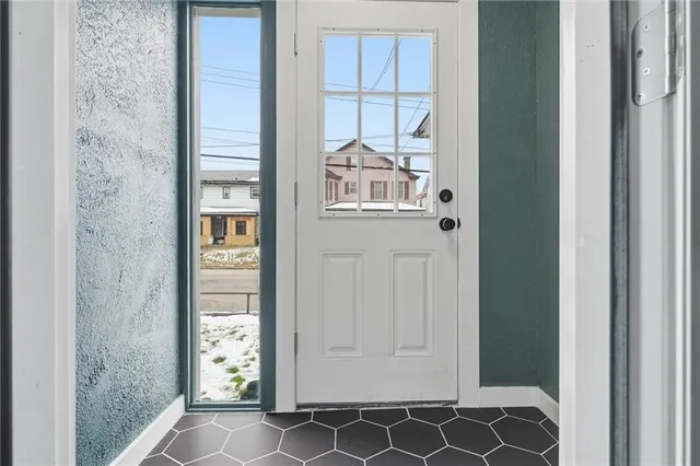 a view of a closet area with chandelier