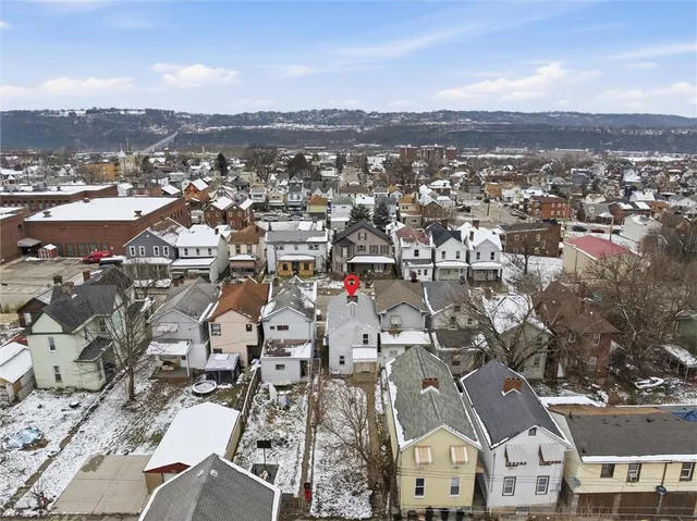a picture of a wall with a white wall and a white refrigerator