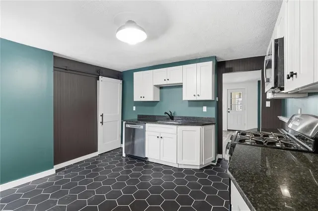 a kitchen with a sink and cabinets