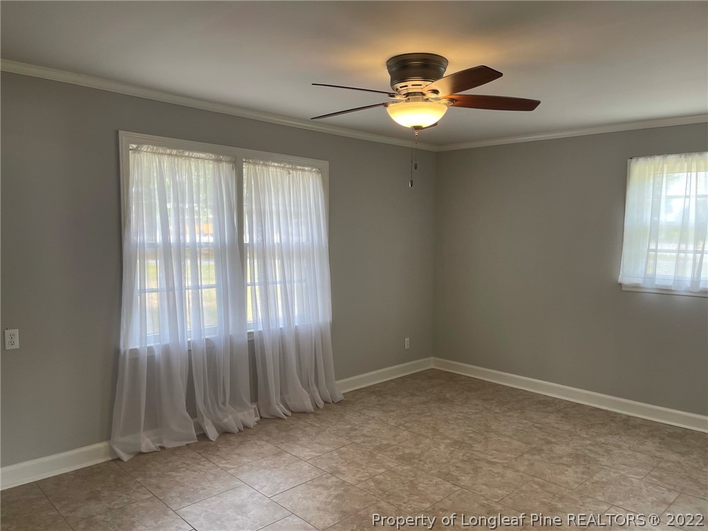 1500 Meadowlark Road Dunn, NC 28334 - Photo 11 of 19 wooden floor in an empty room with a window
