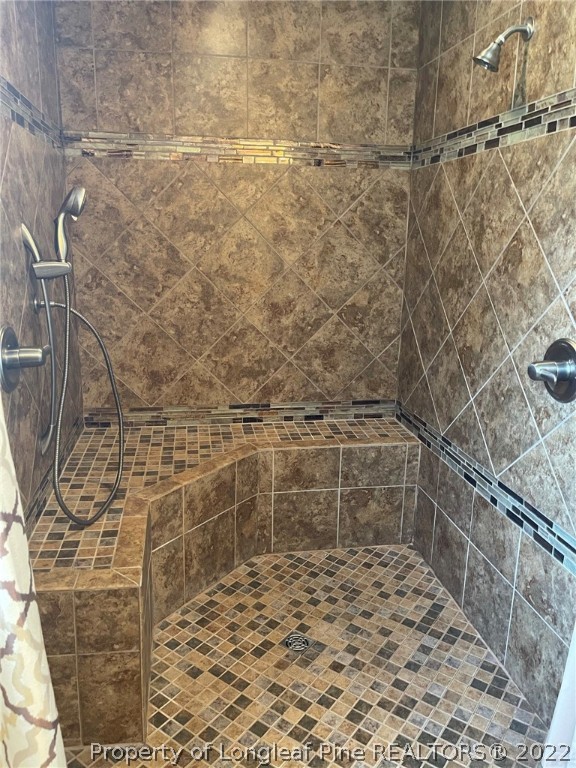 1500 Meadowlark Road Dunn, NC 28334 - Photo 13 of 19 a bathroom with a shower