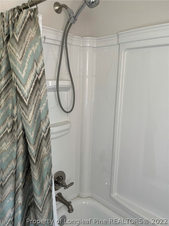 1500 Meadowlark Road Dunn, NC 28334 - Photo 19 of 19 a bathroom with a shower