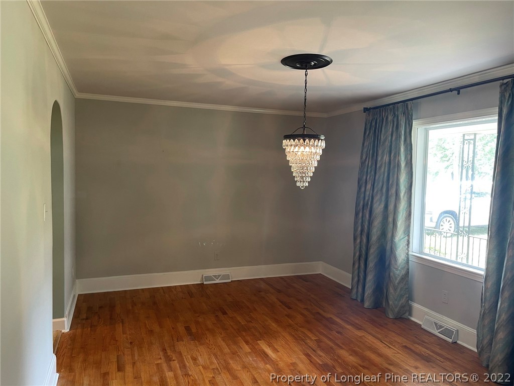 1500 Meadowlark Road Dunn, NC 28334 - Photo 8 of 19 a view of empty room with wooden floor and fan