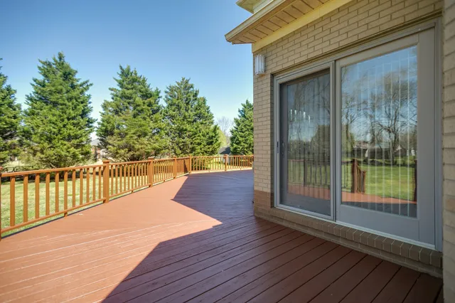 a balcony with wooden floor