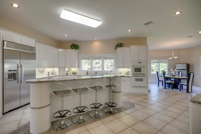 a kitchen with counter top space cabinets and stainless steel appliances