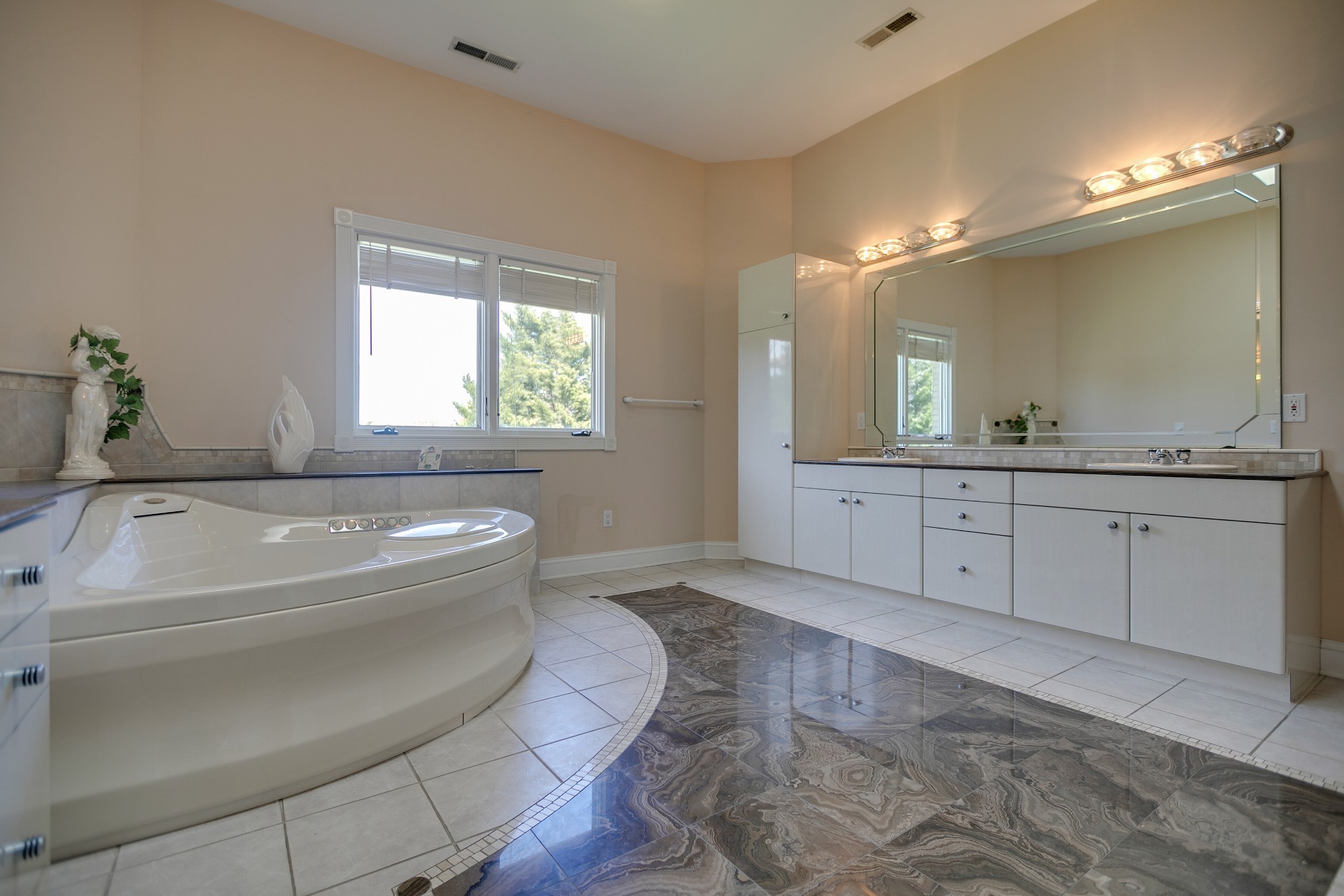 970 9th Street Lawrenceburg, TN 38464 - Photo 33 of 50 a spacious bathroom with a tub sink and mirror