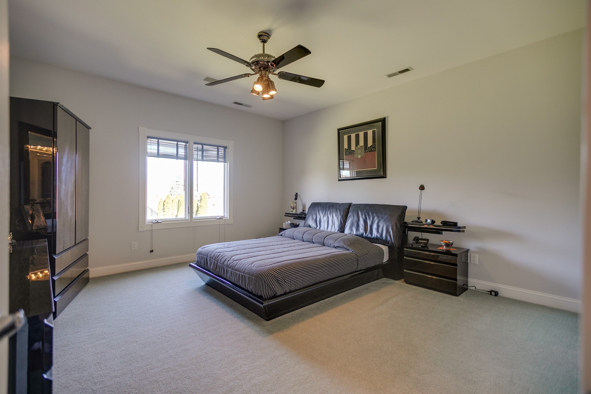 970 9th Street Lawrenceburg, TN 38464 - Photo 38 of 50 a bedroom with a bed and a chandelier