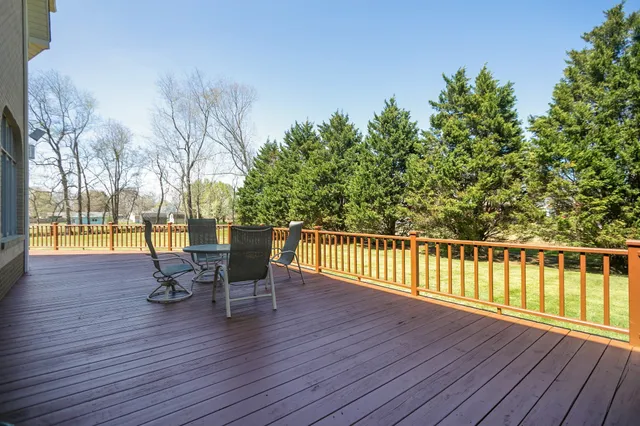 a deck with wooden floor and outdoor space