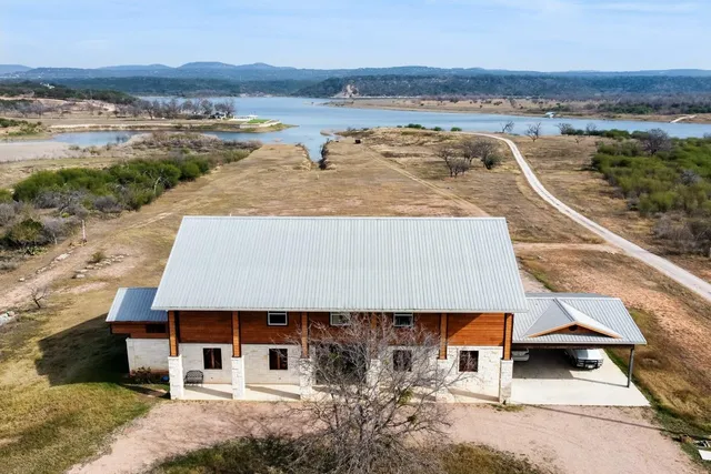 an aerial view of a house with a ocean view