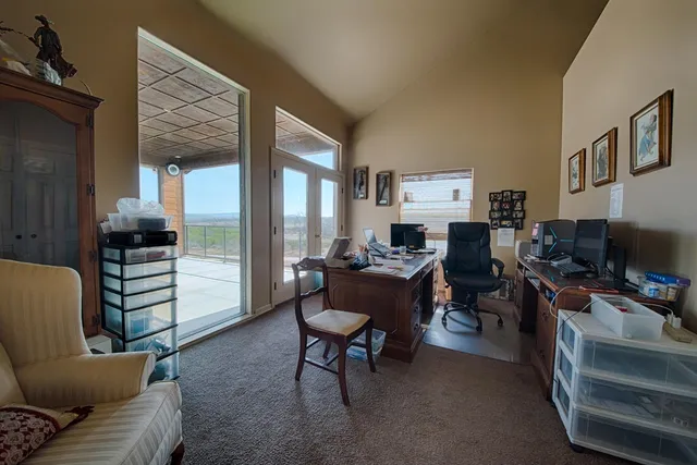 a bedroom with a bed a desk and chair
