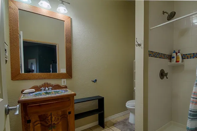 a view of a hallway with wooden shelves