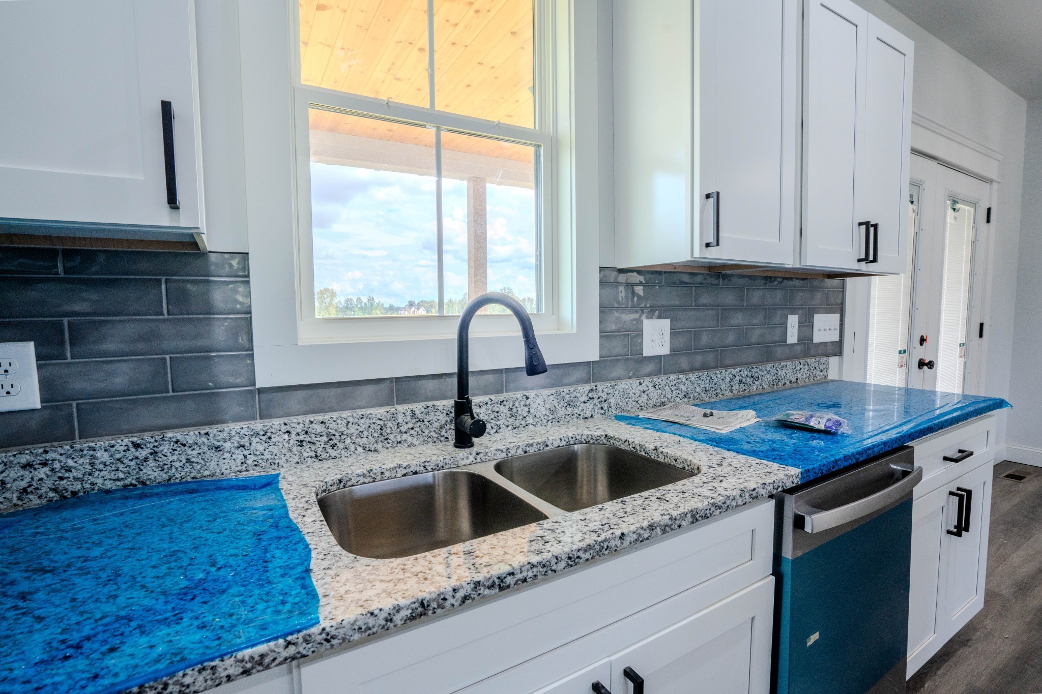 176 Beartown Road Loretto, TN 38469 - Photo 12 of 46 a kitchen with granite countertop a sink and a window