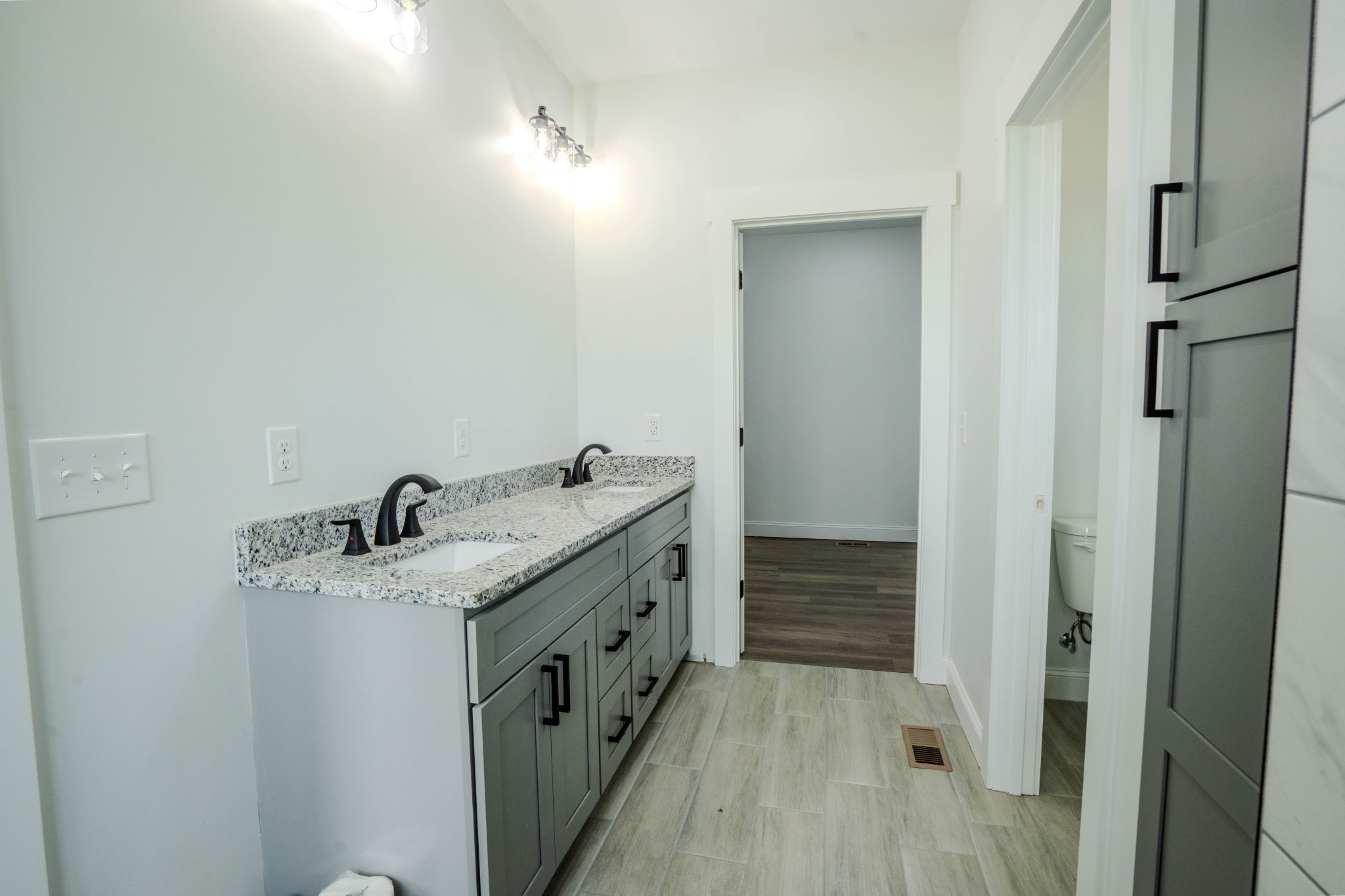 176 Beartown Road Loretto, TN 38469 - Photo 33 of 46 a bathroom with a granite countertop sink and a mirror