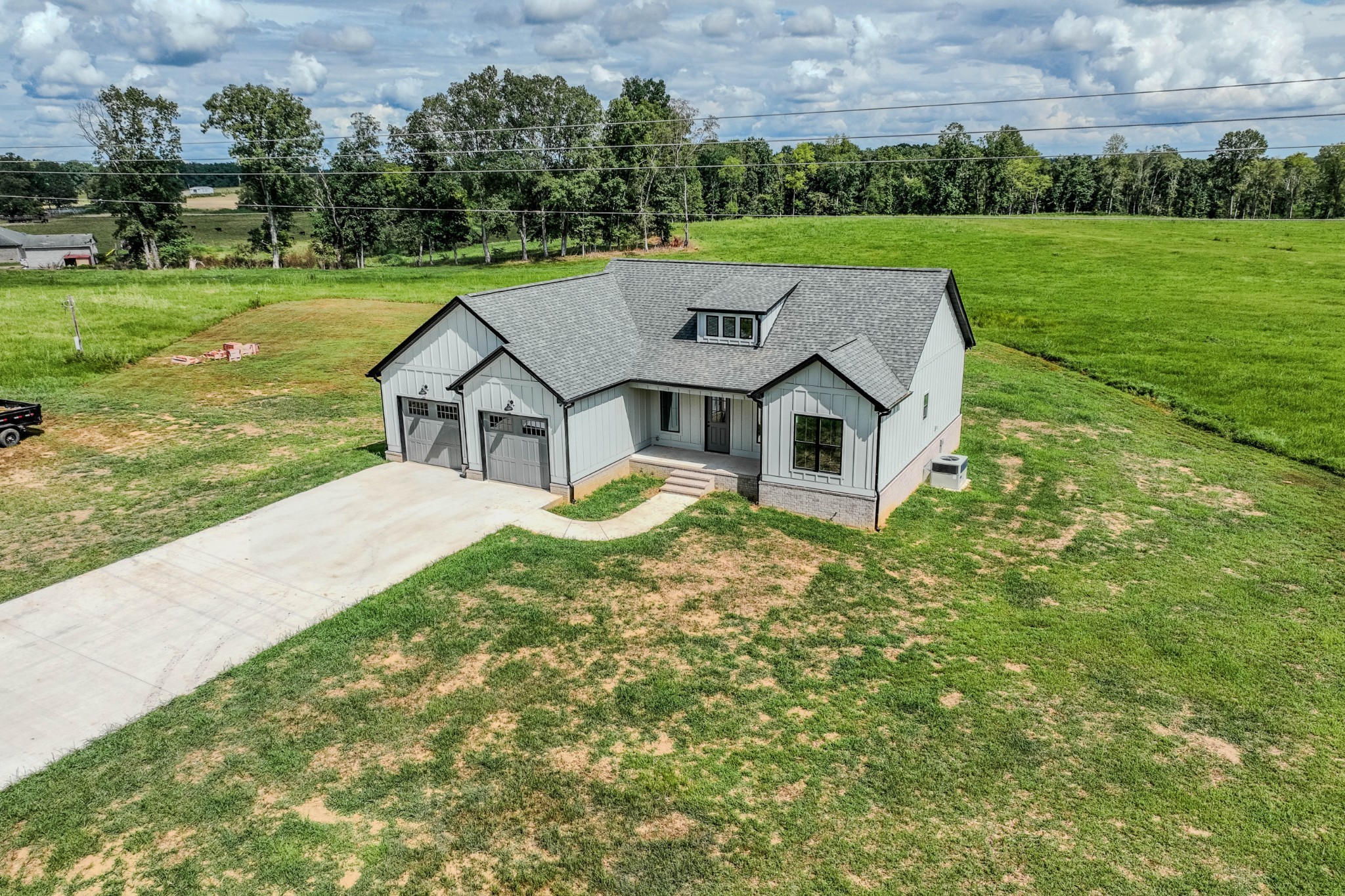 176 Beartown Road Loretto, TN 38469 - Photo 41 of 46 a aerial view of a house next to a big yard and large trees