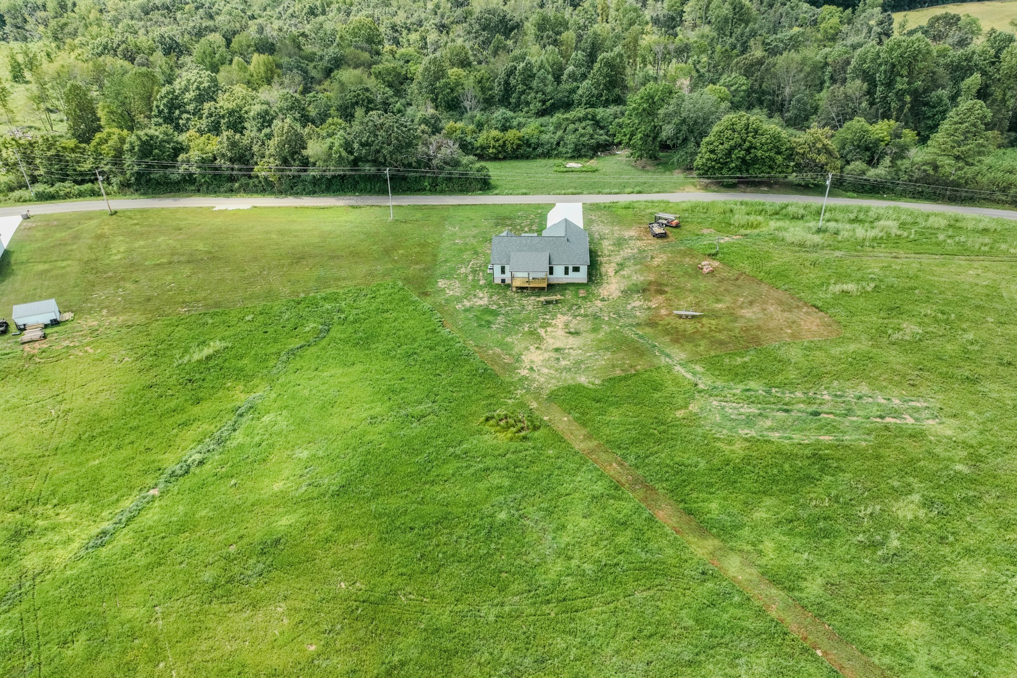 176 Beartown Road Loretto, TN 38469 - Photo 42 of 46 a view of a golf course with a lake