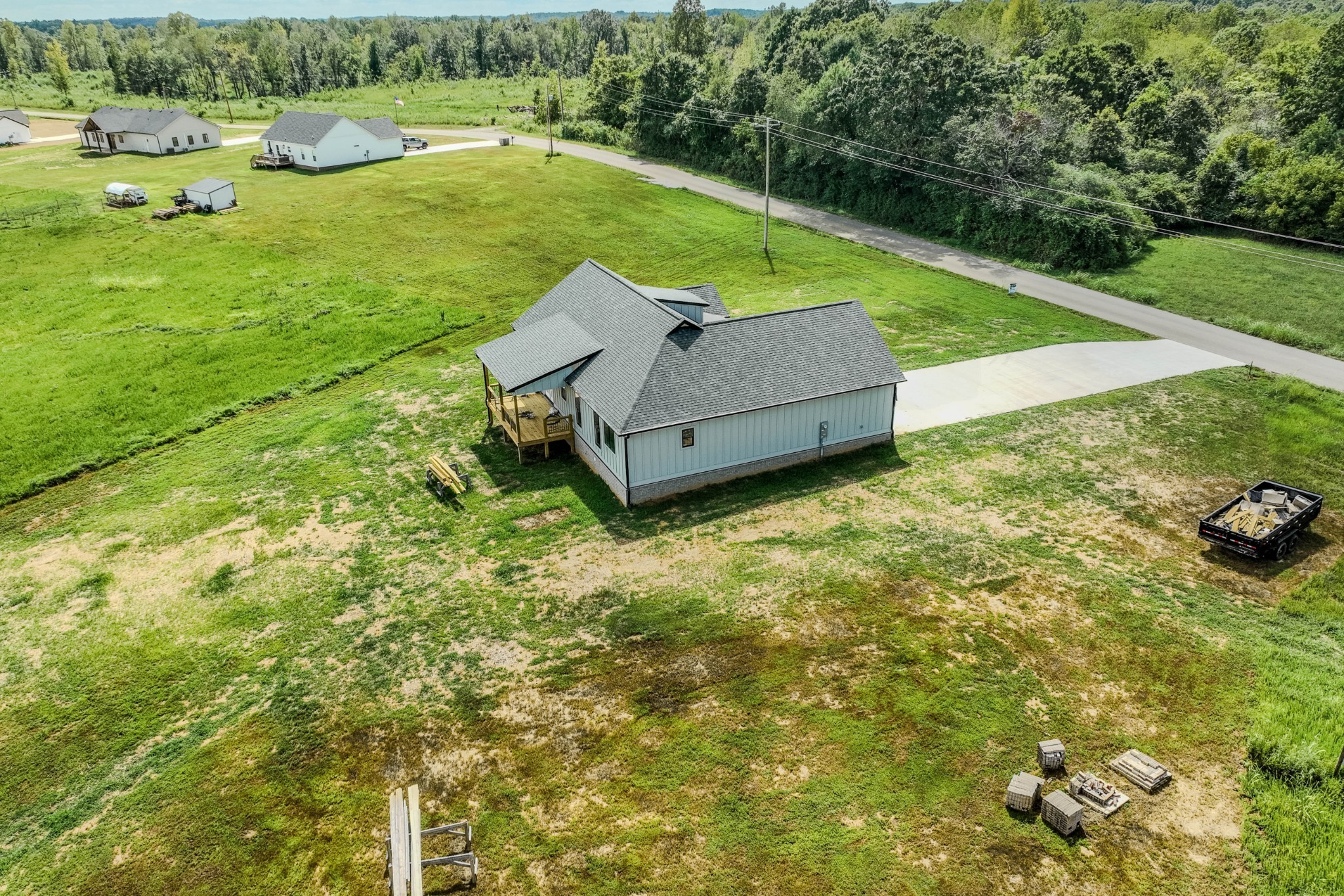 176 Beartown Road Loretto, TN 38469 - Photo 45 of 46 a view of a garden with lawn chairs and plants
