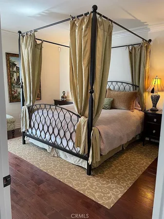 a bedroom with a bed window and a walk in closet