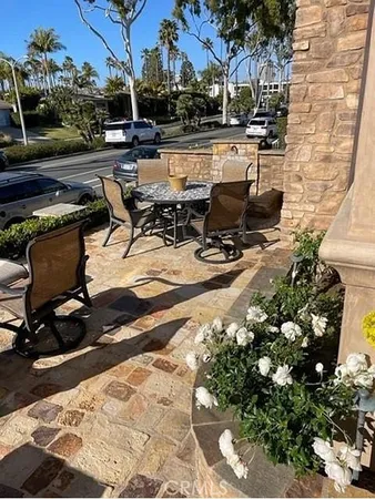 a view of a backyard with sitting area