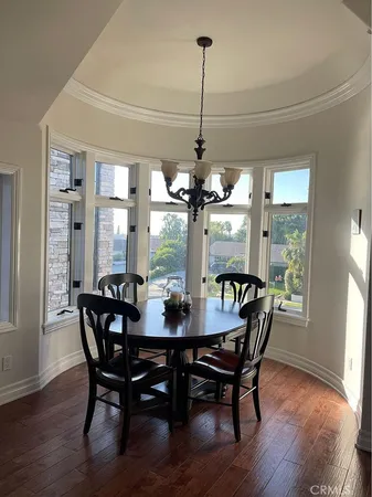 a bedroom with a bed window and a table