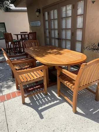 a view of a dinning table and chairs in the patio